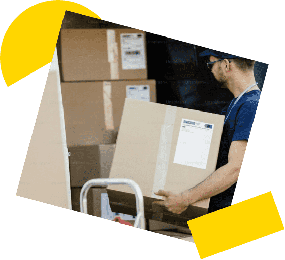 man loading a van with cardboard boxes