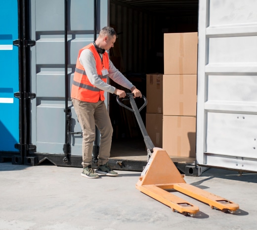 Man loading boxes into a storage container